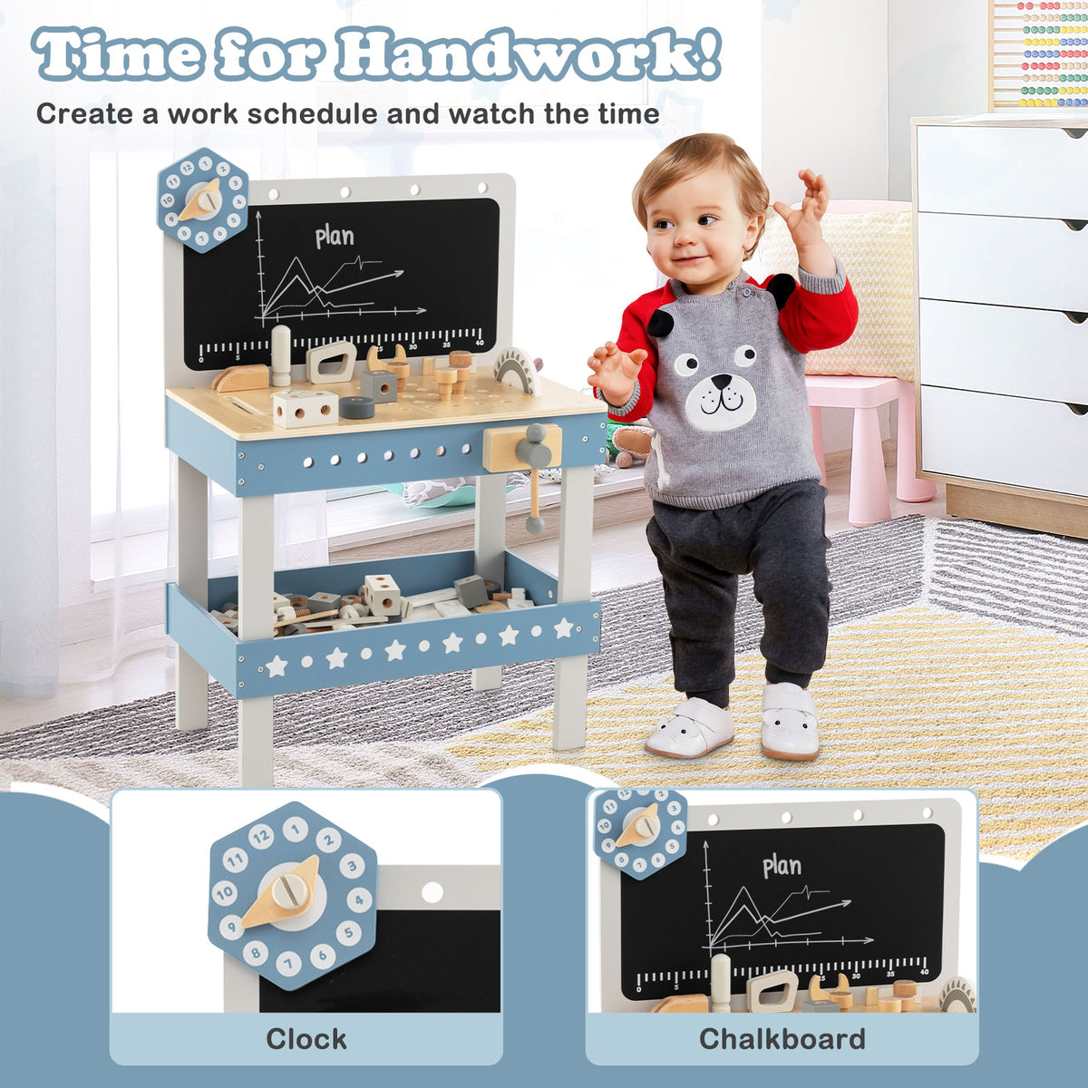 A toddler plays with the blue wooden workbench, which has a blackboard and clock feature