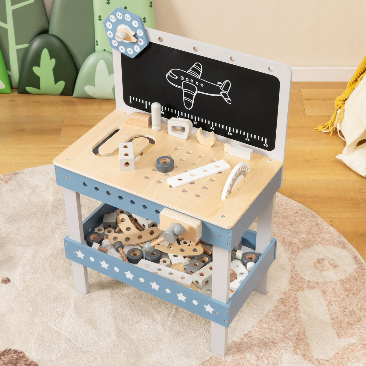 The pretend toy workbench is shown with a collection of wooden parts and tools on its shelves