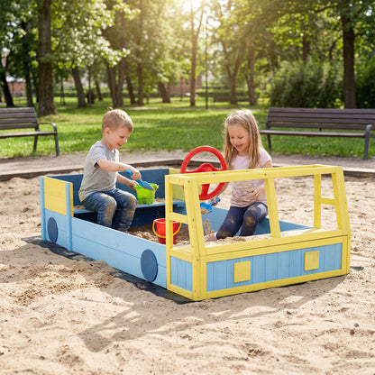 The car sand box placed on a sandy ground in a park with two children playing with toys