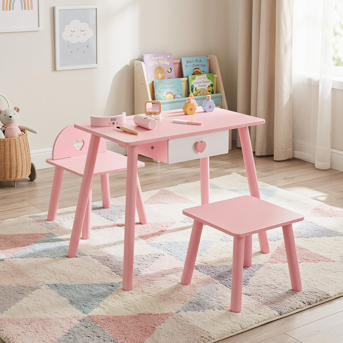 The pink wooden toddlers makeup and manicure table with a heart-shaped chair and a stool