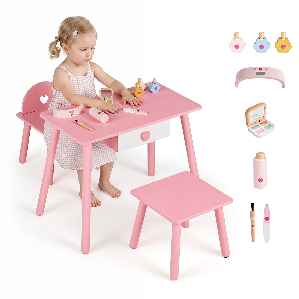 A toddler sitting at the kids vanity set with toy accessories displayed on the tabletop