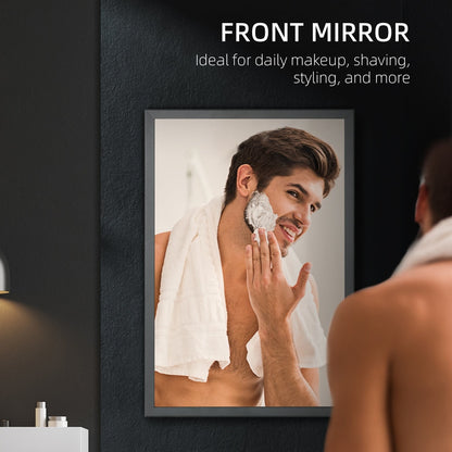 a man shaving in front of the bathroom mirror cabinet