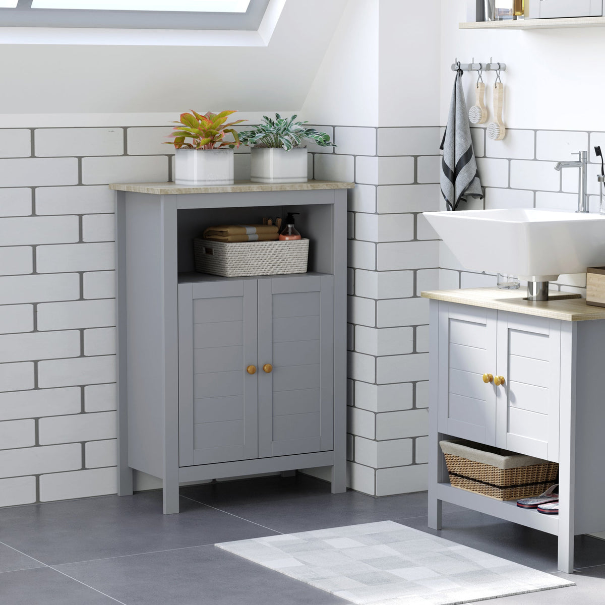 the bathroom cabinet placed in a corner next to a sink unit in a tiled room