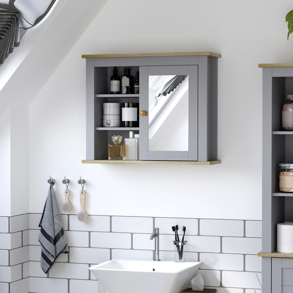 Grey bathroom wall cabinet with a mirrored door and internal shelves holding toiletries