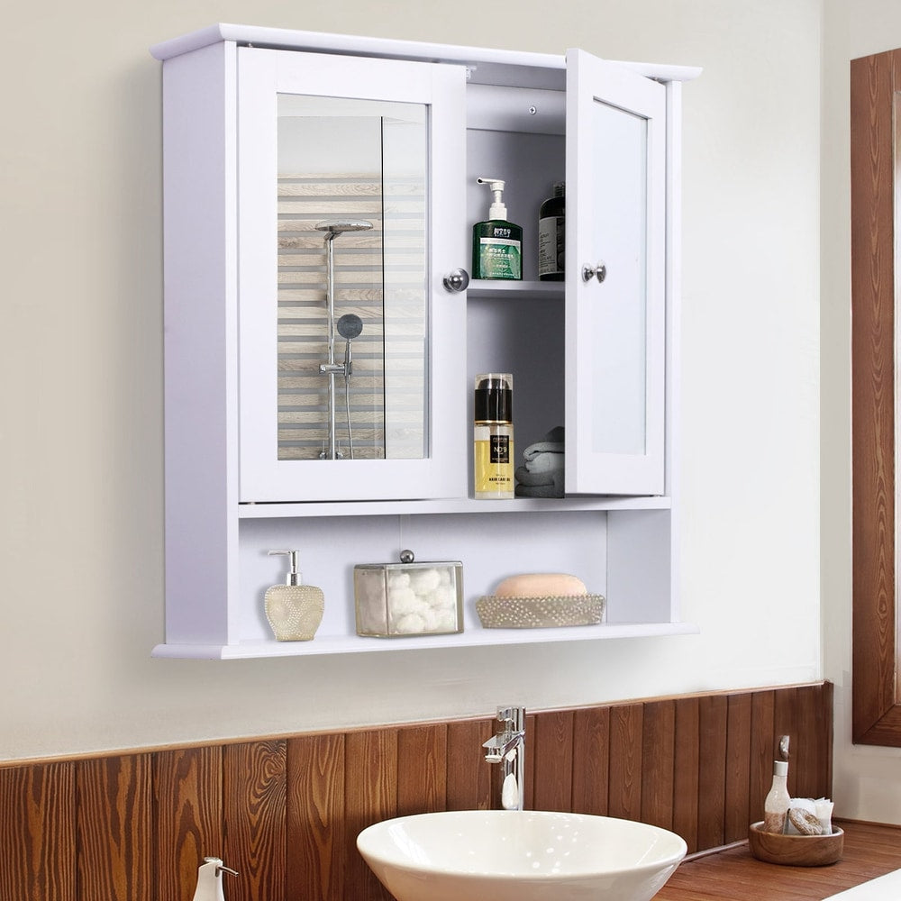 the bathroom cabinet mirror with its doors open, showing internal shelves with toiletries