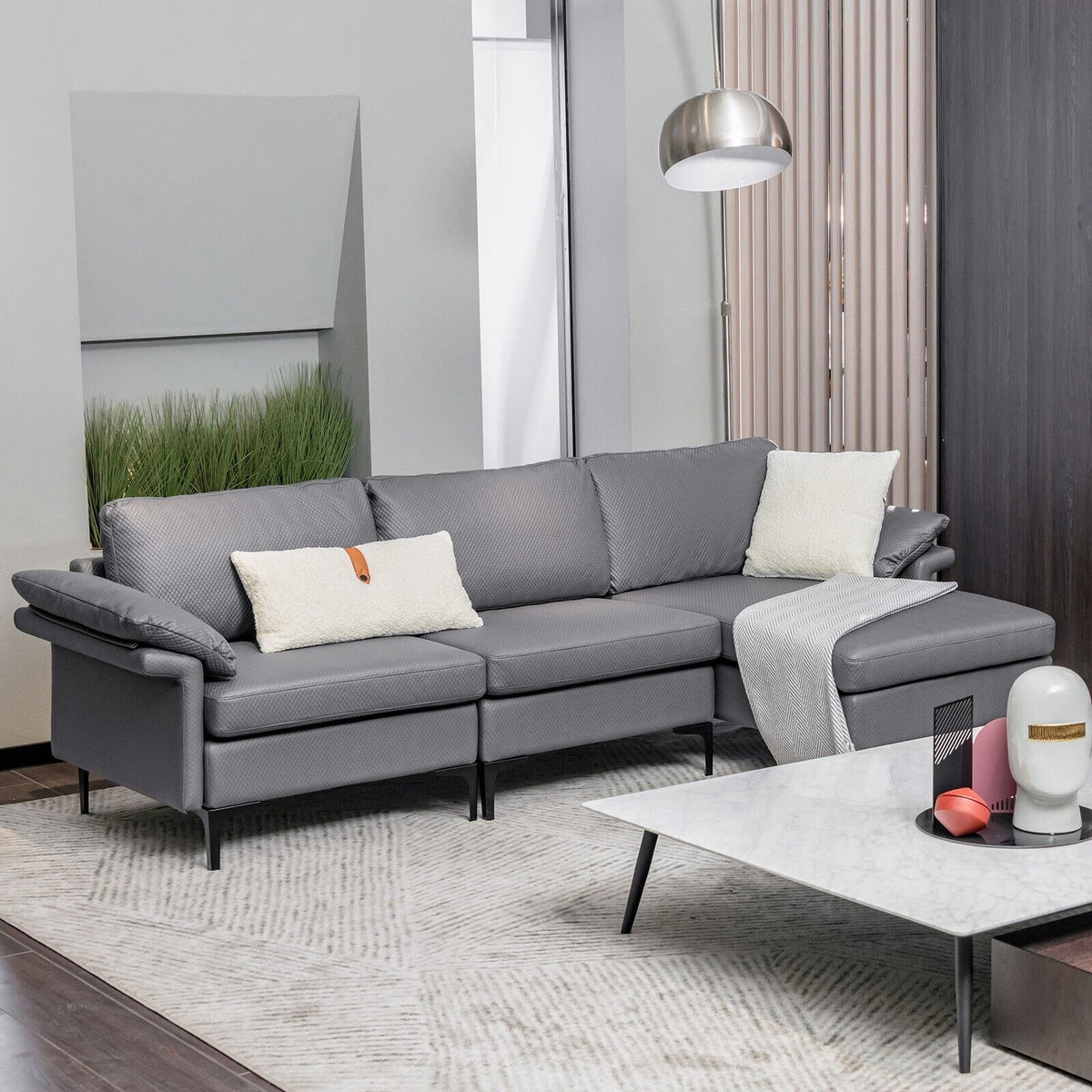 Grey upholstered sectional sofa with chaise in a modern living room setting