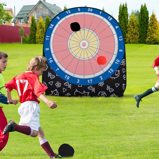 The large dart board for kids being played with by children outdoors on the grass