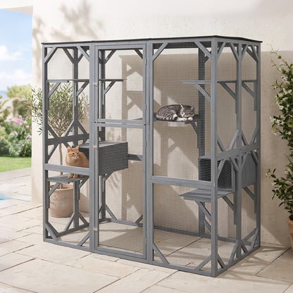 This large outdoor cat enclosure is positioned on a paved patio area