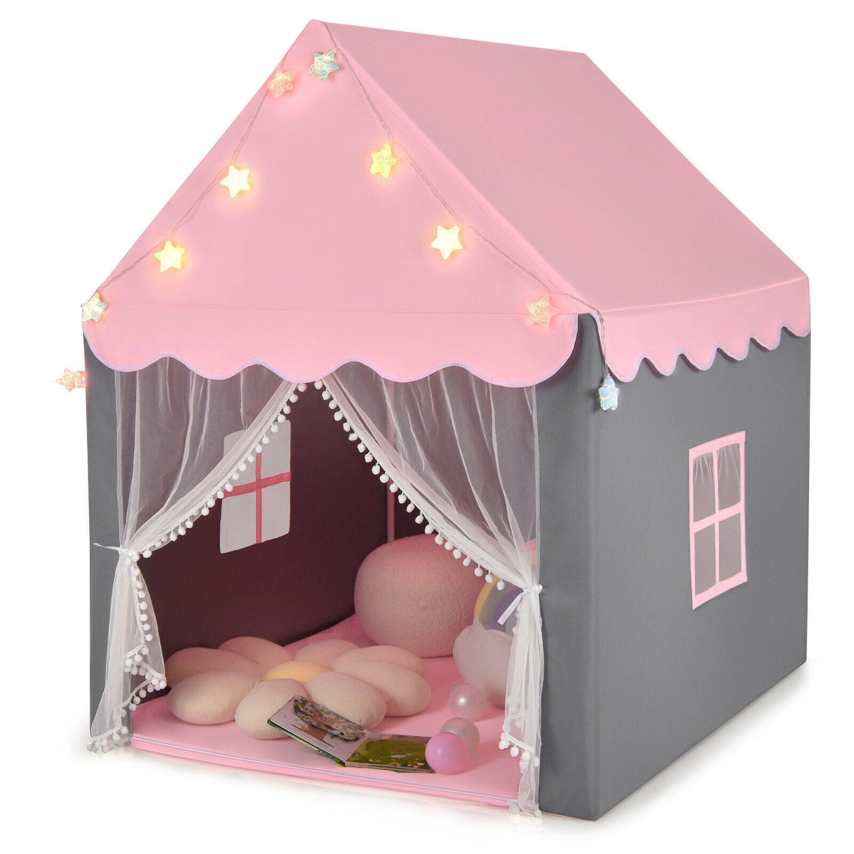Large Kids Play House with pink roof and star lights set up with a mat and cushions inside