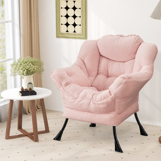 Pink accent chair placed next to a small round table in a bright room