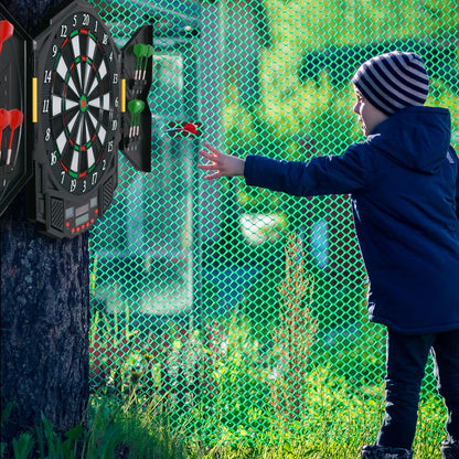 The game room board attached to a tree with a child throwing a dart towards the target
