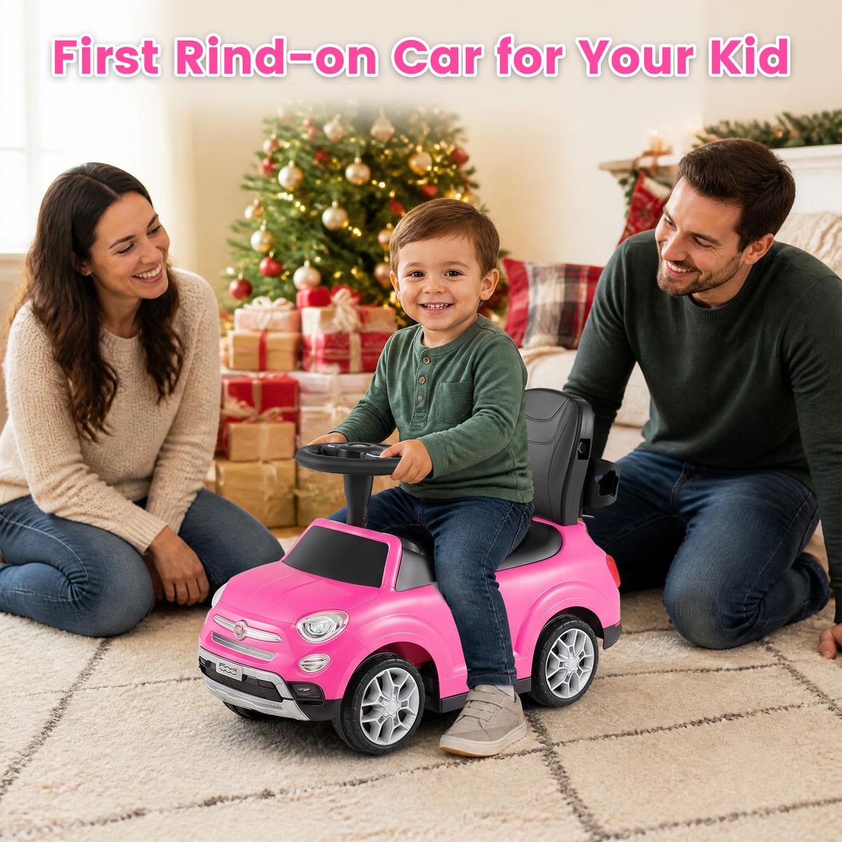 A family smiles at a toddler in the pink push & pedal ride on toy indoors