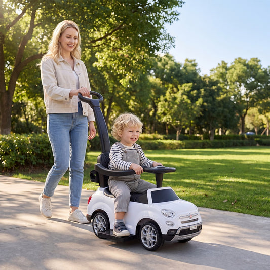 The push car being used by a young child on a sunny outdoor path with an adult