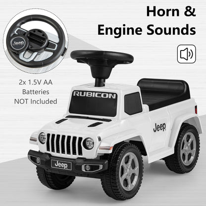 The white ride on push car with steering wheel and engine sound details highlighted