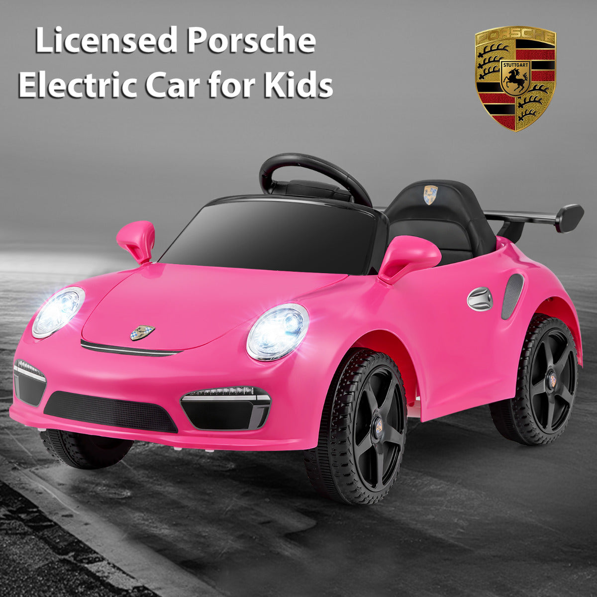 Rose pink electric car with Porsche badge and lights on, studio shot