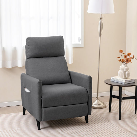 The dark grey recliner armchair is shown in a living room setting next to a lamp and side table
