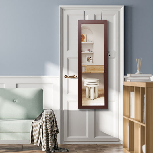 The jewelry armoire hanging on a white door in a bright living room setting