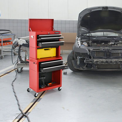 Red and black tool storage cabinet in a garage setting next to a car