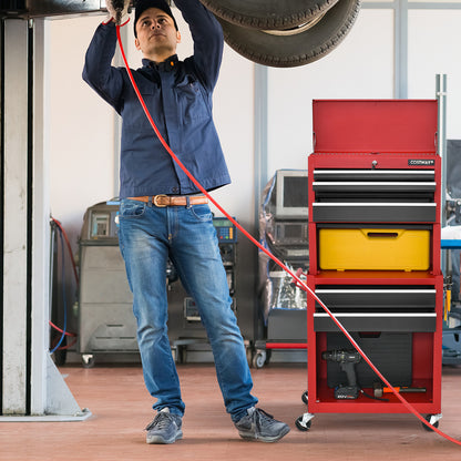 Mechanic using a red and black tool storage cabinet in a workshop