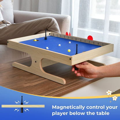 Close up of the Magnetic Mini Foosball Table with a hand controlling a player