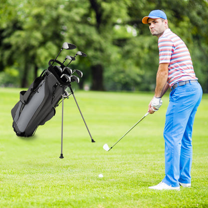 Man playing golf with the grey golf clubs package set on a green course