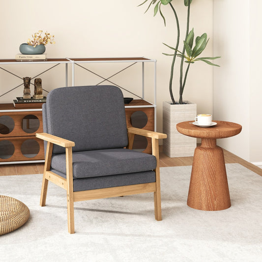 The accent chair placed in a bright living room next to a small wooden side table