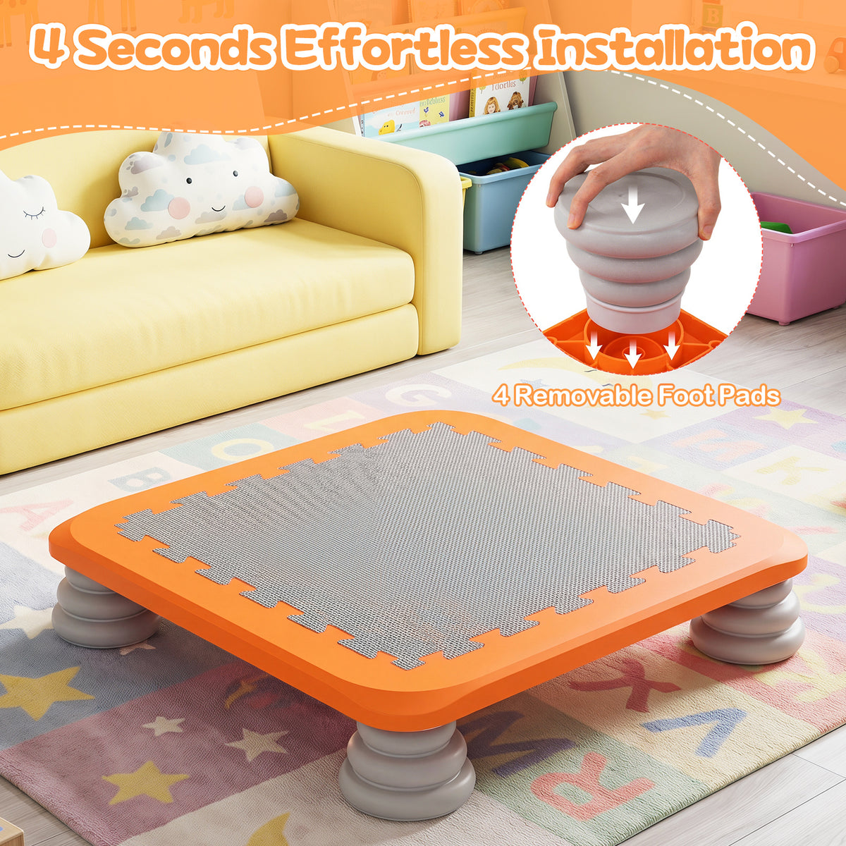 The square trampoline in a playroom with a hand attaching one of the removable foot pads