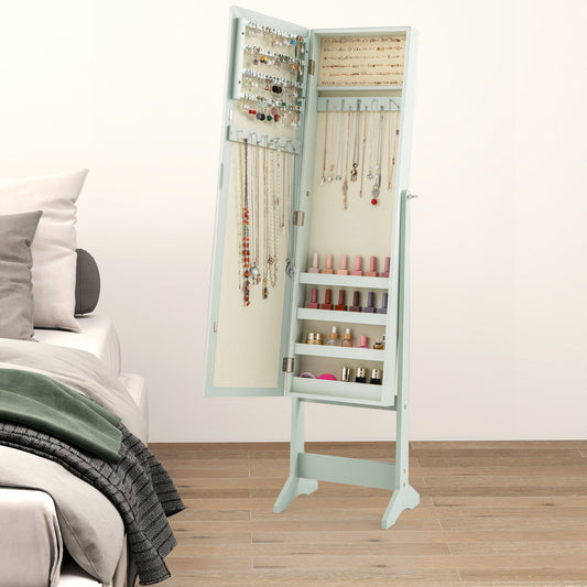 The jewelry cabinet standing open in a bedroom next to a bed with pillows