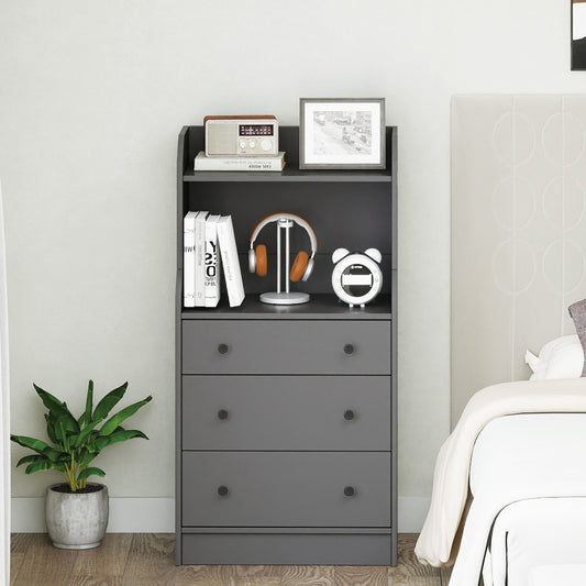 The grey chest of drawers dresser with shelves in a bedroom next to a bed and plant