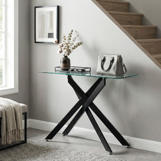 The console table placed in a hallway with a handbag and vase on the glass surface