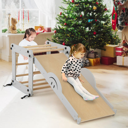 The foldable climbing frame with slide in a festive room with a Christmas tree