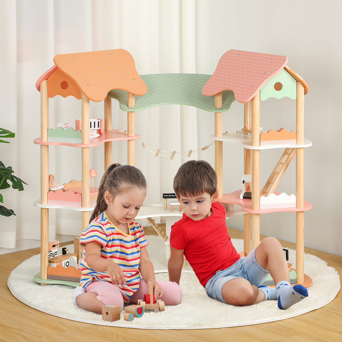 A young boy and girl playing with the wooden playhouse on a circular rug in a bright room