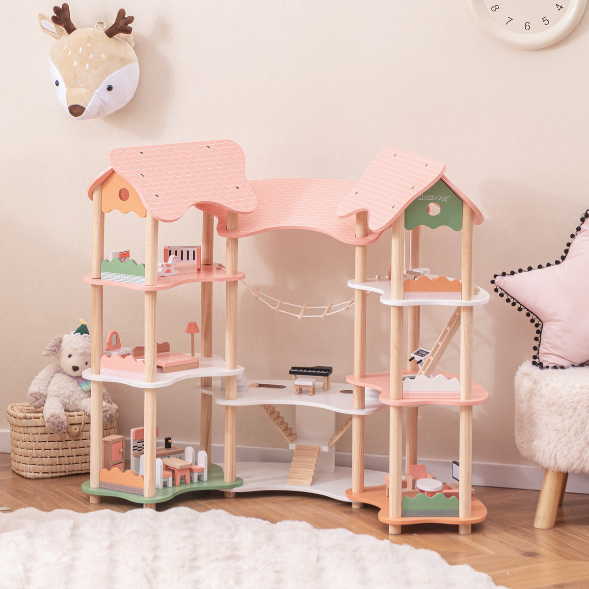 The pink dollhouse playhouse with multiple levels and rooms
