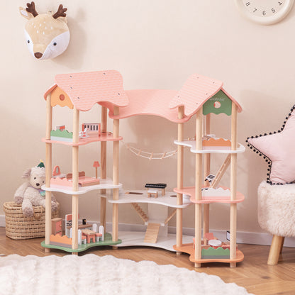 The pink dollhouse playhouse with multiple levels and rooms