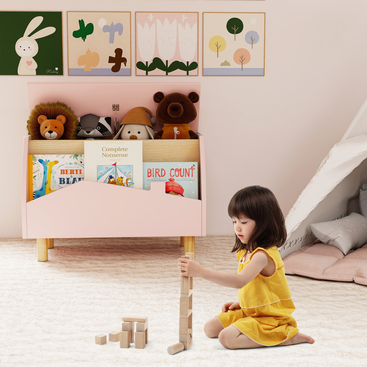The kids storage unit placed in a playroom with a child playing on the floor
