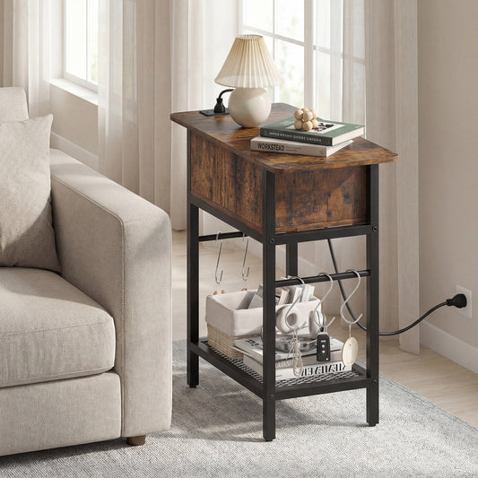 The side table placed next to a beige sofa with a lamp and books on the top surface