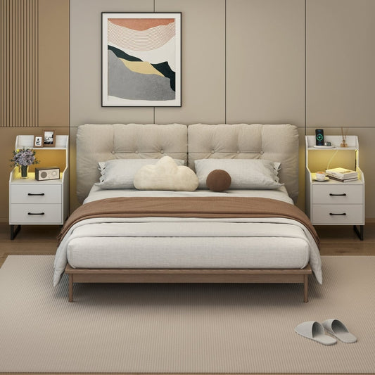 Two white bedside tables in a bedroom setting next to a bed