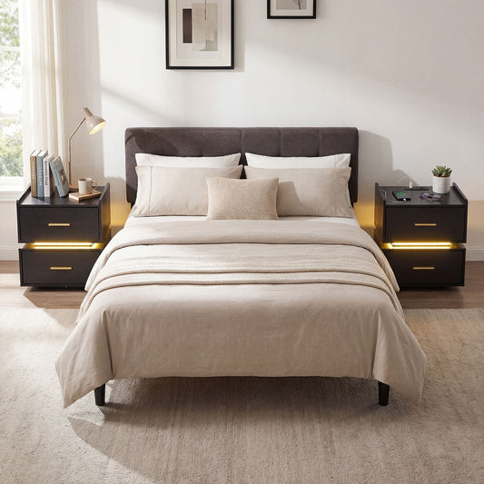 Black bedside table with two drawers and blue LED lighting