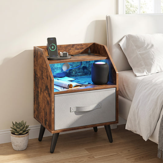 Rustic brown nightstand with LED lights and charging station shown in a bedroom setting next to a bed