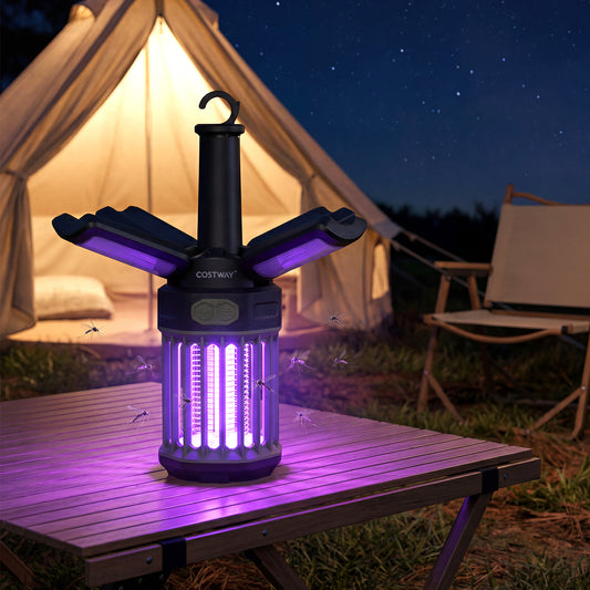 The camping furniture glowing purple on a wooden table outside a tent at night