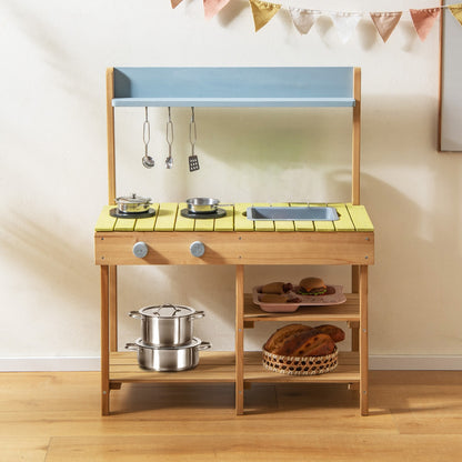 The wooden play kitchen set with toy food and a basket of fruit on the shelf