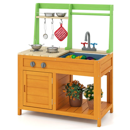 A close-up view of the outdoor play kitchen set, showing the hob, sink, taps and storage cupboard