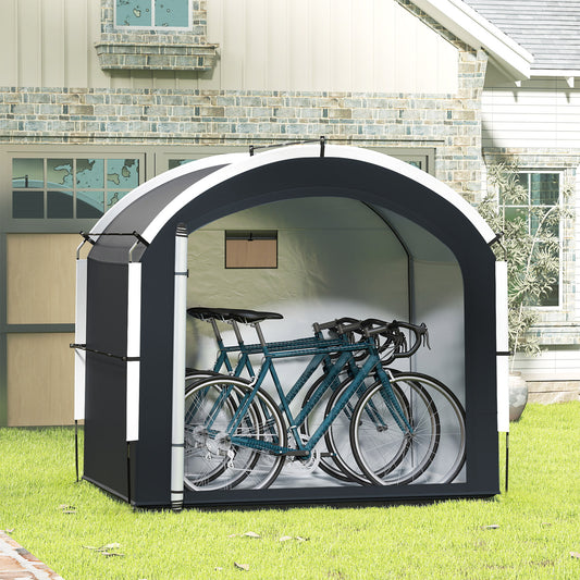 The portable bicycle cover shelter storing three bicycles in a garden setting