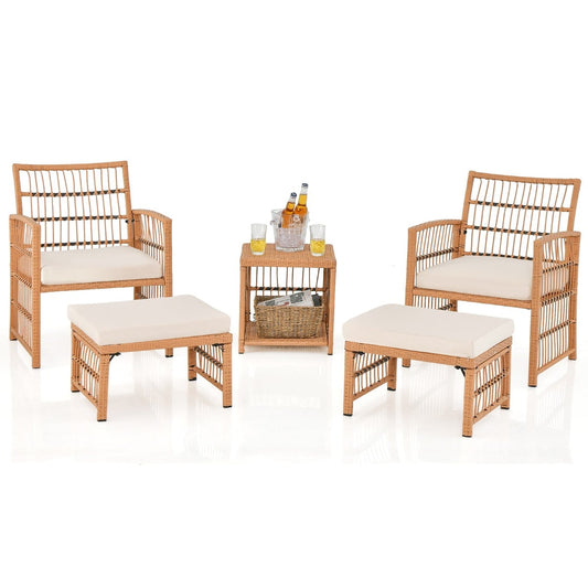Outdoor Rattan Conversation Set with two chairs, two ottomans and a small side table on white background