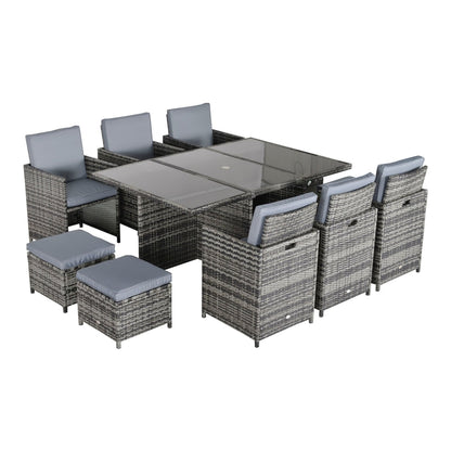 Outsunny 10 Seater Rattan Cube Garden Furniture Set arranged for dining with chairs and stools around the table