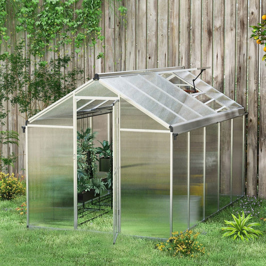 Walk-in greenhouse with open door and plants inside, set up in a garden