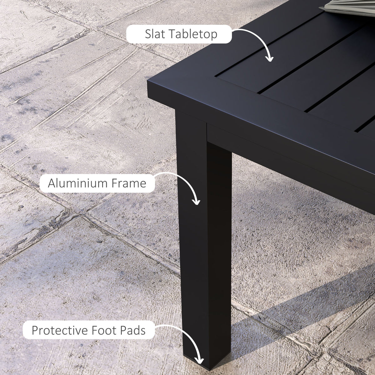 Close up of the black garden table showing the slat tabletop and aluminium frame