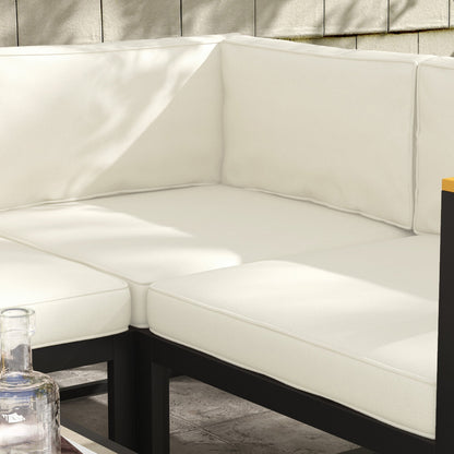 Close up of the cream seat cushions on a black framed outdoor sofa