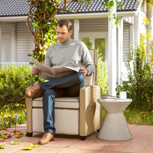 Man reading a newspaper in the rattan armchair on a patio next to a small table