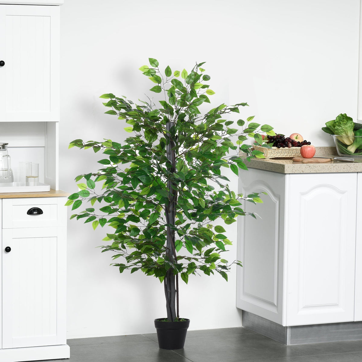 The artificial plant is shown in a bright kitchen setting on a tiled floor